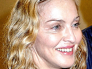 Папарацци застукали Мадонну без макияжа