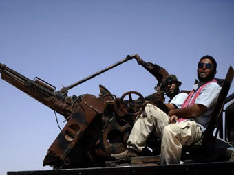 В Ливии повстанцы захватили часть родного города Каддафи
